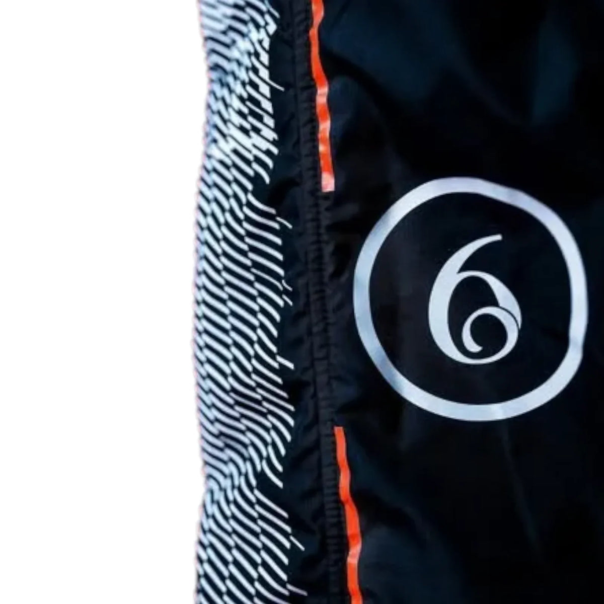 Close-up of a black athletic garment with a white circular logo containing the number 6, a white-and-black wavy stripe pattern panel, and a thin orange accent line.