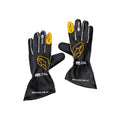 2026 McLaren F1 Racing Gloves with yellow and white branding details, displayed against a solid white background.
