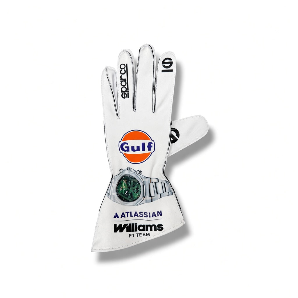 2026 Williams Racing F1 Team Gloves featuring the orange and blue Gulf logo on the back of the hand, a silver watch attached near the wrist, and 'Williams F1 TEAM' printed in black on the cuff.