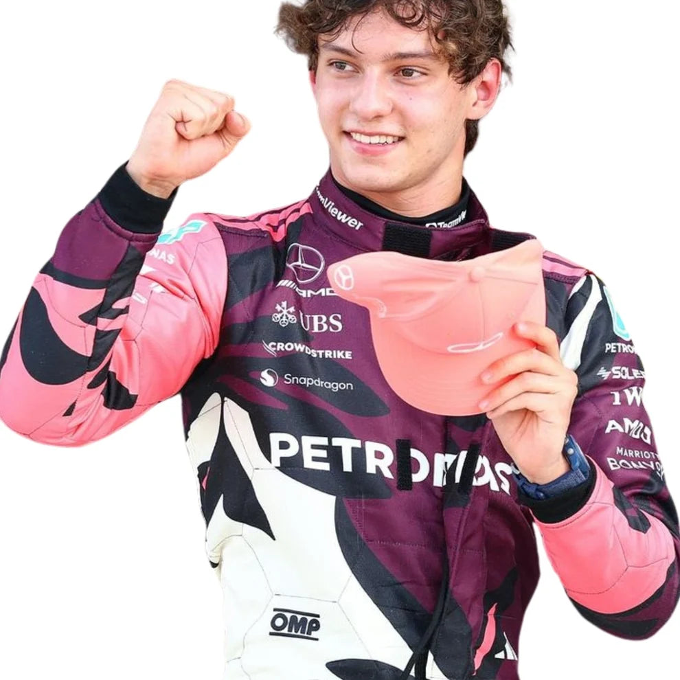 Andrea Kimi Antonelli in Mercedes 2025 Miami GP F1 Racing Suit holding a pink helmet with visible branding on a white background