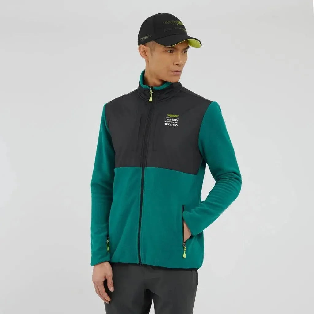 Man wearing a green and black jacket with a visible brand logo on a white background