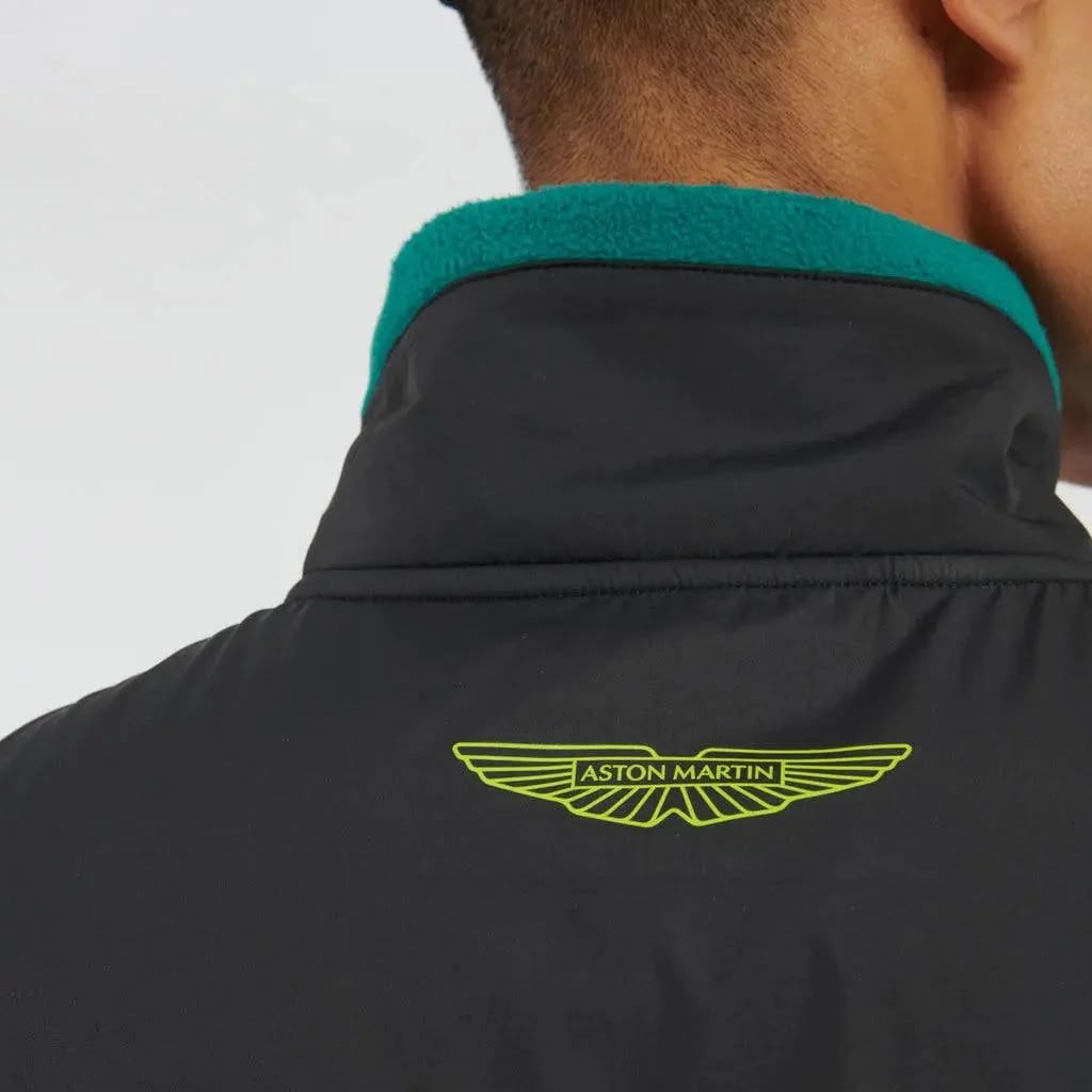 Black jacket with green collar and Aston Martin logo on a white background