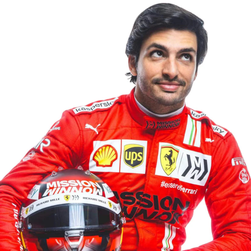 Carlos Sainz in Ferrari 2021 F1 Racing Suit with various sponsor logos, holding a helmet.
