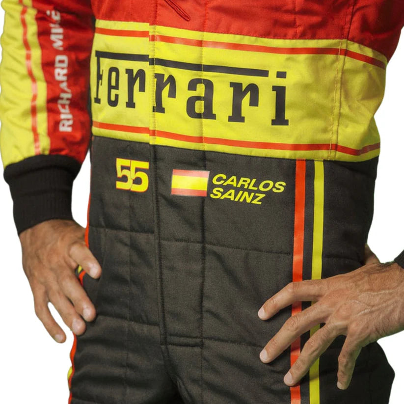 Close-up of a racing suit with Ferrari branding and 'Carlos Sainz' name on a white background