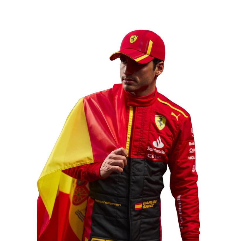 Carlos Sainz in Ferrari 2023 Spain Grand Prix F1 Racing Suit with a Spanish flag draped over one shoulder on a white background