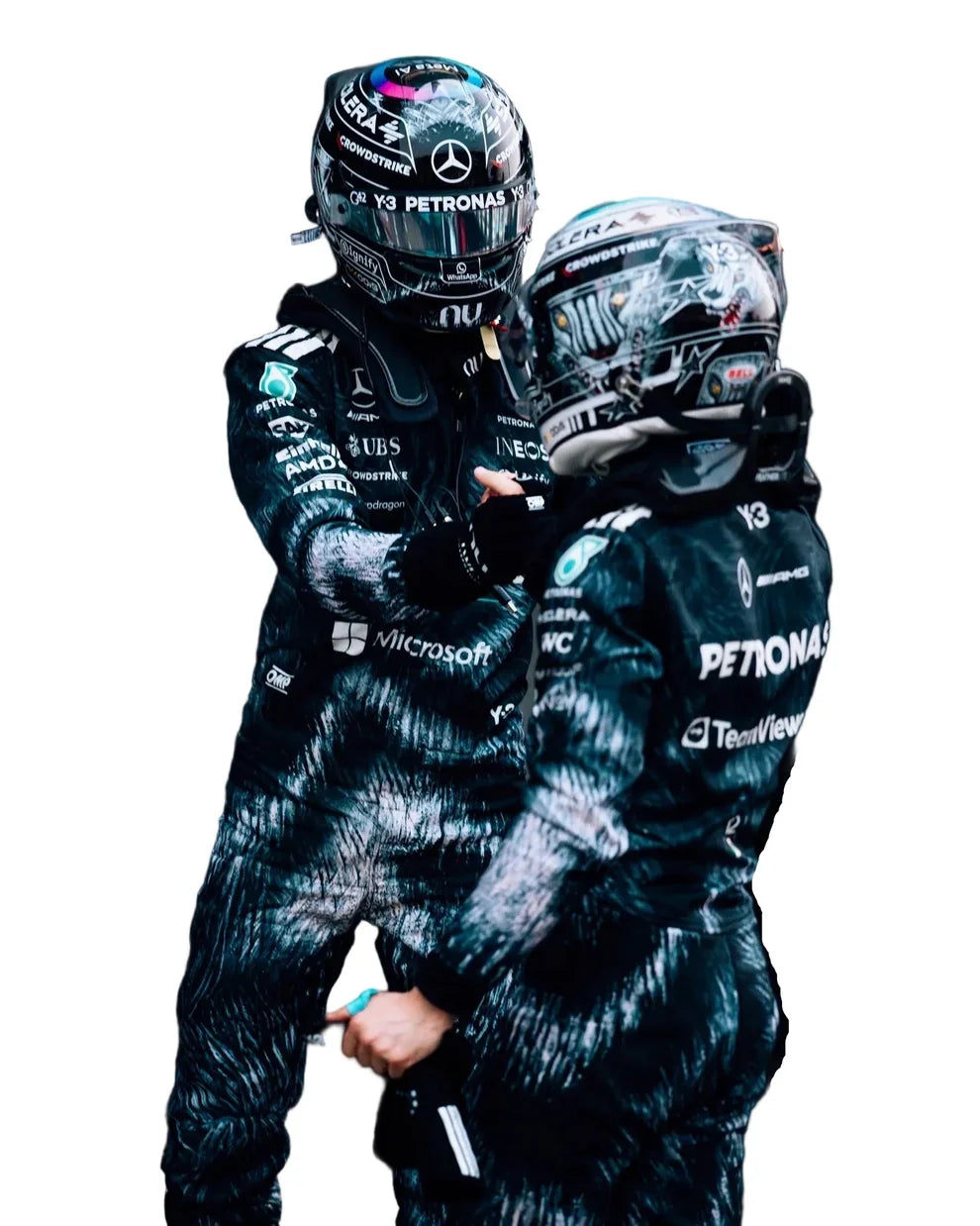 Two Formula 1 drivers in matching black suits with visible branding on a white background