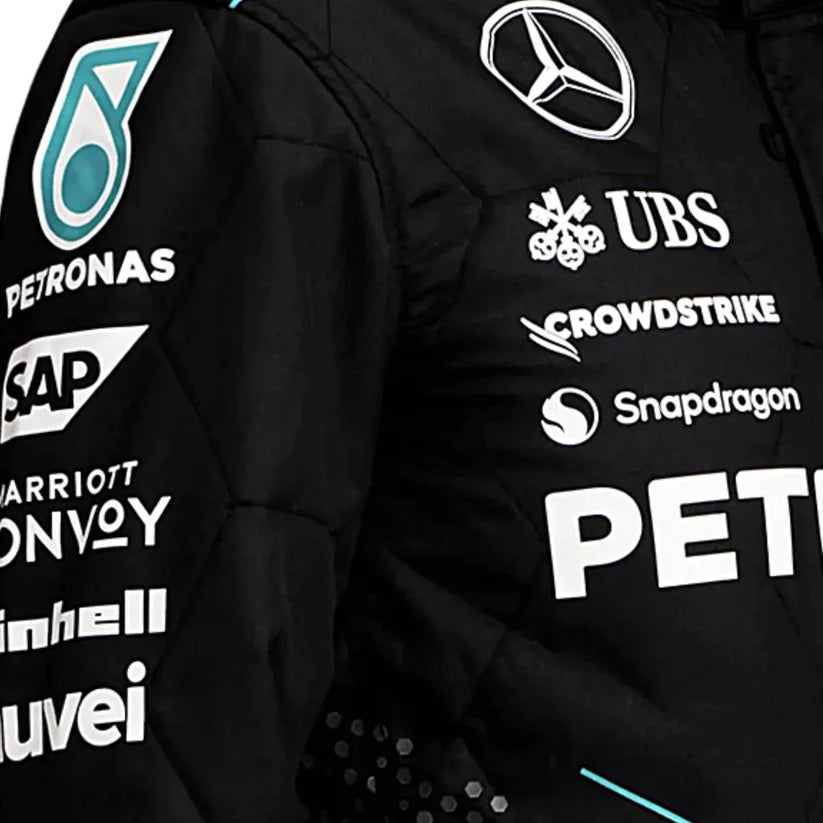 Black F1 Suit with various brand logos on a dark background
