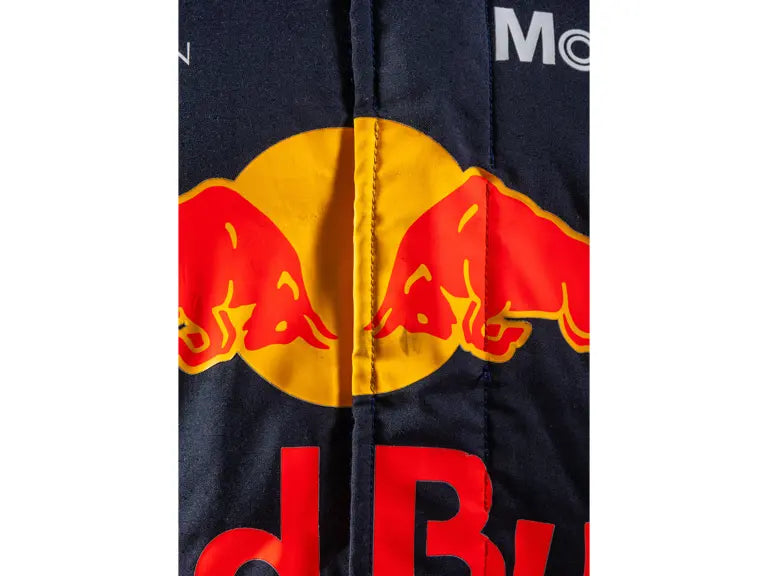 Close-up of a jacket with Red Bull logo on a white background