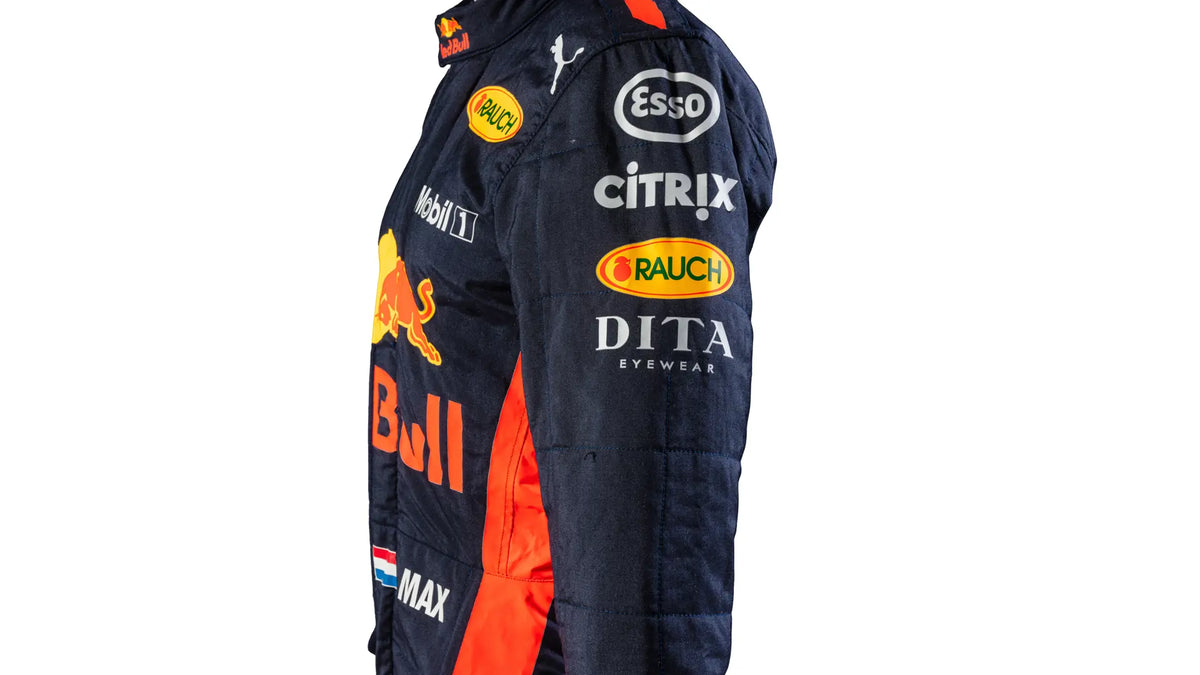 Navy jumpsuit with various sponsor logos on a white background