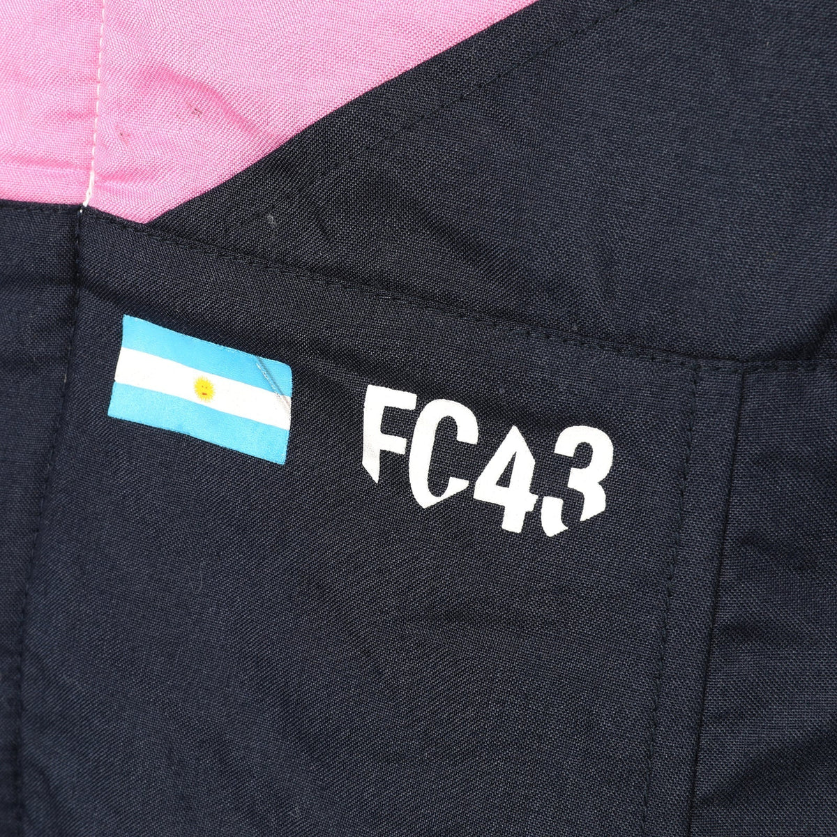 Franco Colapinto FC43 and Argentina flag detail on the 2026 Alpine F1 race suit – Reaxion Racegear.